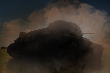 Obraz premium Silhouette of tank on battlefield. Military machinery