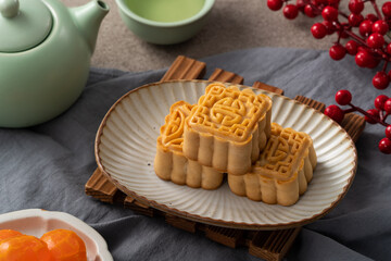 Delicious mung bean moon cake for Mid-Autumn Festival food mooncake on gray table background.