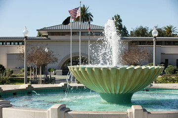 Afternoon view of a public water fountain in downtown Monrovia, California, USA. - obrazy, fototapety, plakaty