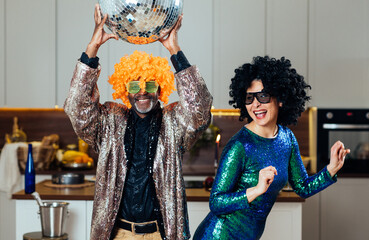 cinematic image of an happy multiethnic senior couple. Indoors Lifestyle moments at home. Concept...