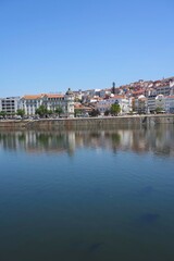 Fototapeta na wymiar Scenery of Coimbra city and Mondego river in Portugal - vertical