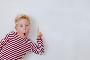 blondie cheerful 6 years old boy over white background