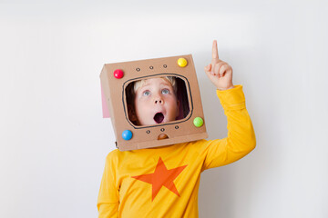 Caucasian Blondie boy over white background/boy in robot, astronaut creative costume