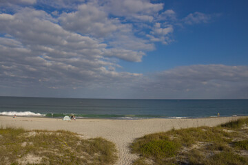 Fototapeta na wymiar Warm winter day on Indialantic Florida beach with seabirds.