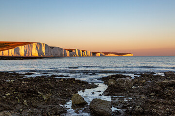 Sunset at the Seven Sisters Cliffs in Sussex, with the Rocky Beach at Hope Gap in the Foreground