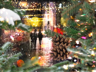 night Christmas tree view on street night city  bokeh   light , car traffic ,pedestrian walk ,rain drops on glass, garland illumination with cone snow flakes town holiday scene