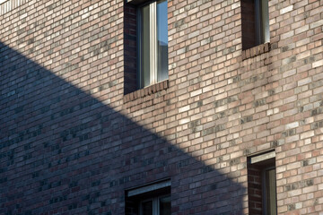 windows of a building in the sun with shadow