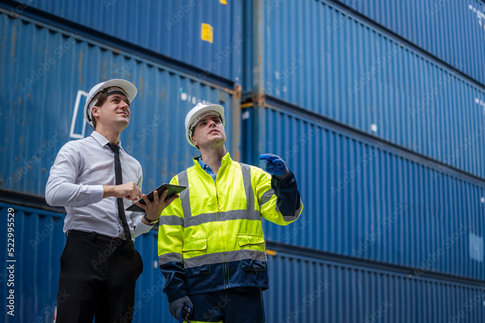 Poster Engineer and inspector working and discuss in shipping container in Container Terminal.