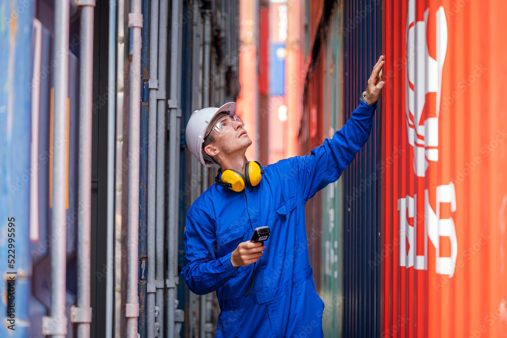 Poster inspector checking container yard organising stock to pack into containers,imported product,logistic