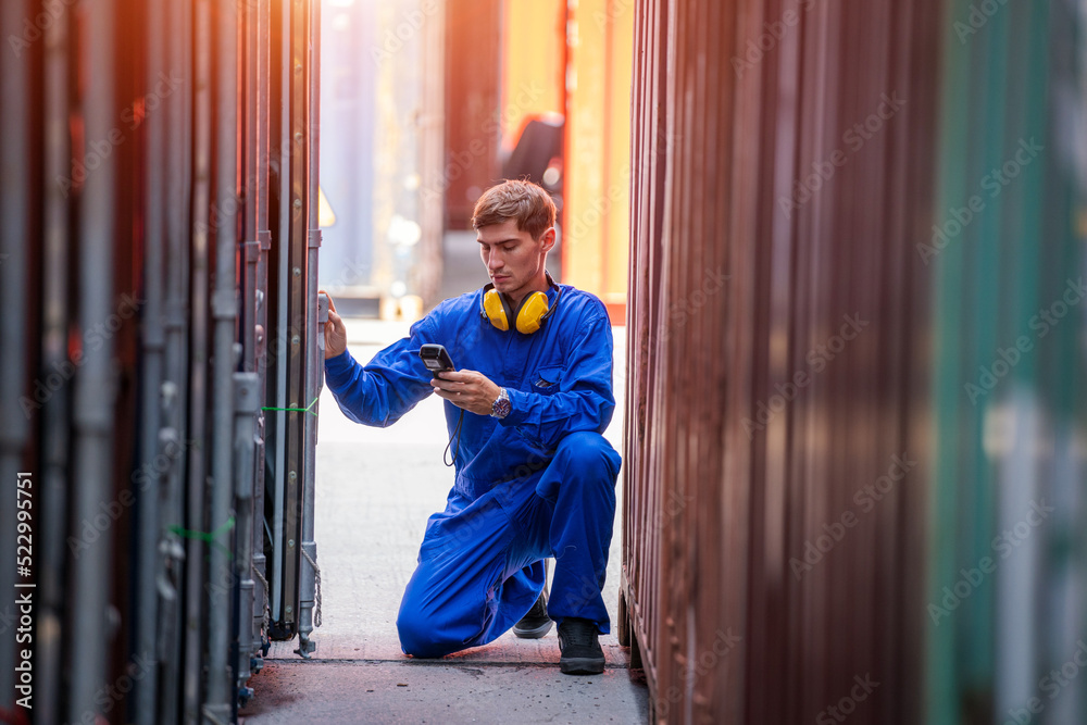 Poster Engineer container cargo working and checking stock into container for loading.logistic transport and business industry export.