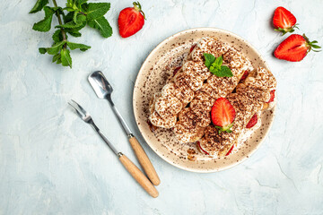 Tiramisu. Homemade tiramisu cake with fresh strawberry, biscuit and whipped cream and mint, Vegan lactose free dessert, Recipe of healthy organic decert