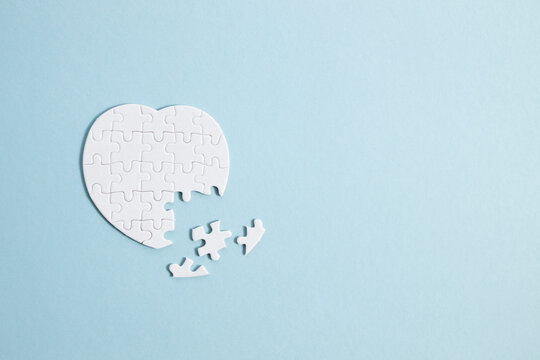 Puzzle Heart With One Missing Piece On Blue, Health Care Concept