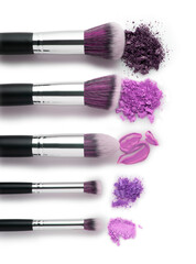 Creative concept beauty fashion photo of cosmetic product make up brushes kit with smashed lipstick eyeshadow on white background.