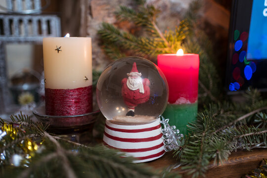 Decorated fireplace with snowball and candle