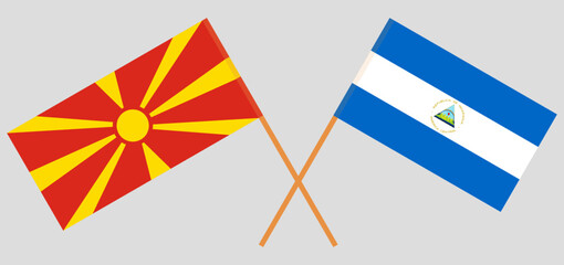 Crossed flags of North Macedonia and Nicaragua. Official colors. Correct proportion