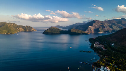 Beautiful seashore. Islands in the distance. Colorful blue sea. The beauty of Turkey. Beautiful rocks and mountains. Sunny clear day. Beautiful water.