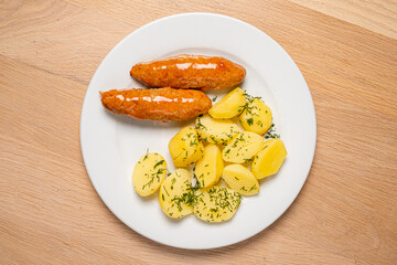 cutlet with baked potato on wooden background