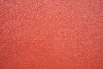 Red cement wall background in vintage style for graphic design or wallpaper. Pattern of soft concrete floor in retro concept.