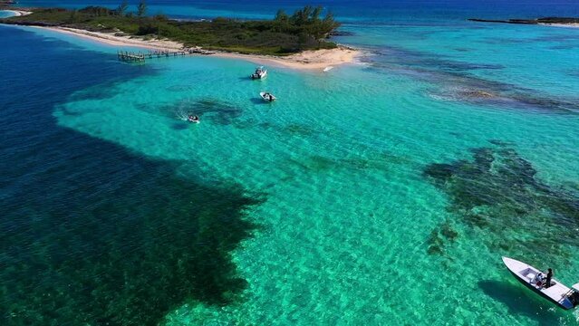 Aerial Panning: People In Nautical Vessels Moving On Sea - Bimini, The Bahamas