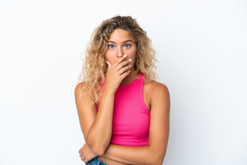 Girl with curly hair isolated on white background surprised and shocked while looking right