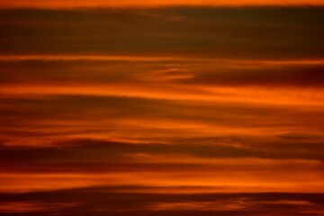 Naklejka na ściany i meble Illusion of waves at sunset in the sky , West Midlands, England, UK