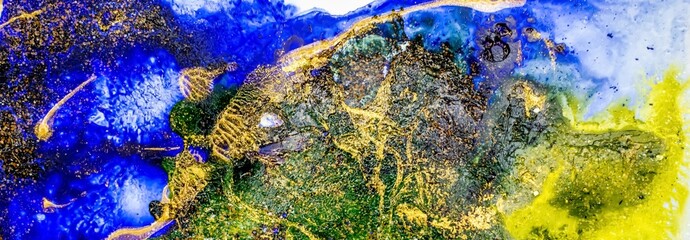 Golden dust and flakes on Alcohol ink fluid abstract texture fluid art with gold glitter and liquid.