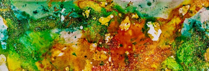 Golden dust and flakes on grungy colors of Alcohol ink fluid abstract texture fluid art with gold glitter and liquid.