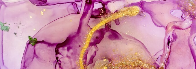 Spill of golden dust on Alcohol ink fluid abstract texture fluid art with gold glitter and liquid.