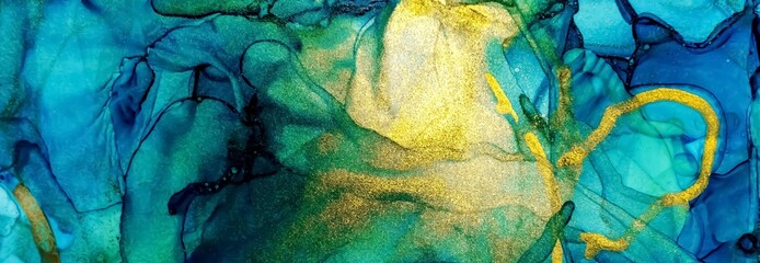 Golden dust and flakes on blue and green Alcohol ink fluid abstract texture fluid art with gold glitter and liquid.