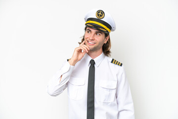 handsome Airplane pilot isolated on white background thinking an idea while looking up