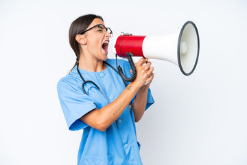 Young nurse woman isolated on white background shouting through a megaphone