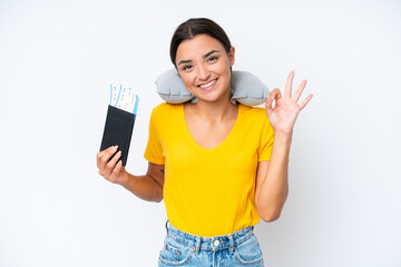 Woman with Inflatable Travel Pillow over isolated background showing ok sign with fingers