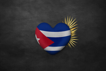 Naklejka premium Textile heart in colors of national flag. Photography and marketing digital backdrop. Cuba