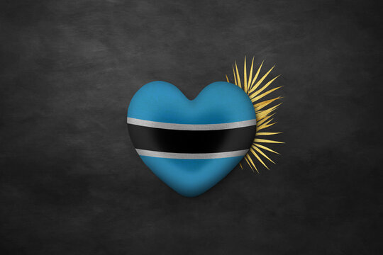 Textile heart in colors of national flag. Photography and marketing digital backdrop. Botswana
