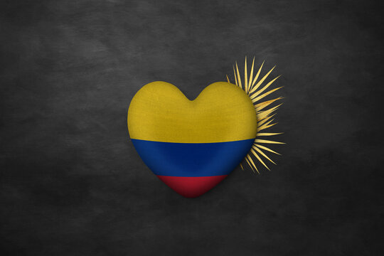 Textile heart in colors of national flag. Photography and marketing digital backdrop. Colombia