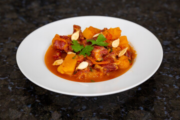Dry meat with pumpkin, traditional Brazilian rustic dish. With salted and toasted pumpkin seeds.
