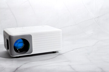 mini projector for house on marble surface