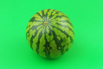 Watermelon on green background close up.	