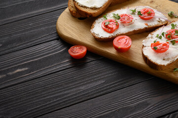 Toasts with microgreens on the table. Healthy food, vegan food and dieting concept.