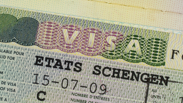 Schengen visa in the passport close-up. French visa.