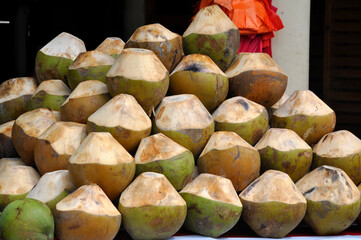 Young coconuts that have been harvested and are ready for sale. Young coconuts are sold for drinking water. The semi-ripe filling is also good to eat.