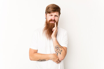 Young caucasian red-haired man isolated on white background having a strong teeth pain, molar ache.