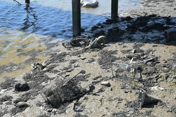 Rubbish dumped on the banks of the River Medway at Strood in kent. 