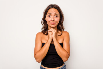 Young hispanic woman isolated on white background scared and afraid.