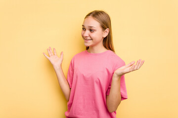 Young caucasian girl isolated on yellow background joyful laughing a lot. Happiness concept.