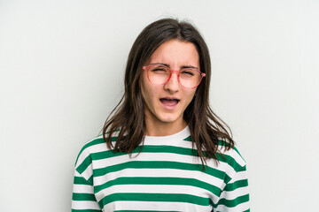 Fototapeta premium Young caucasian woman wearing a glasses isolated on blue background screaming very angry and aggressive.