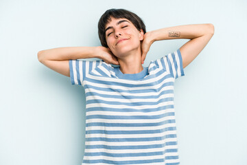 Fototapeta premium Young caucasian woman with a short hair cut isolated feeling confident, with hands behind the head.