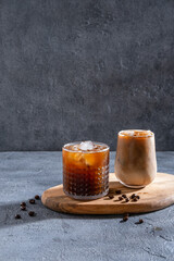 Espresso Tonic, cold drink with espresso and tonic in glass. Ice coffee in a tall glass with cream...