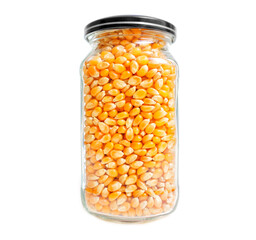 Jar of popcorn kernels isolated on white