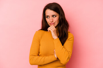 Young caucasian woman isolated on pink background suffers pain in throat due a virus or infection.